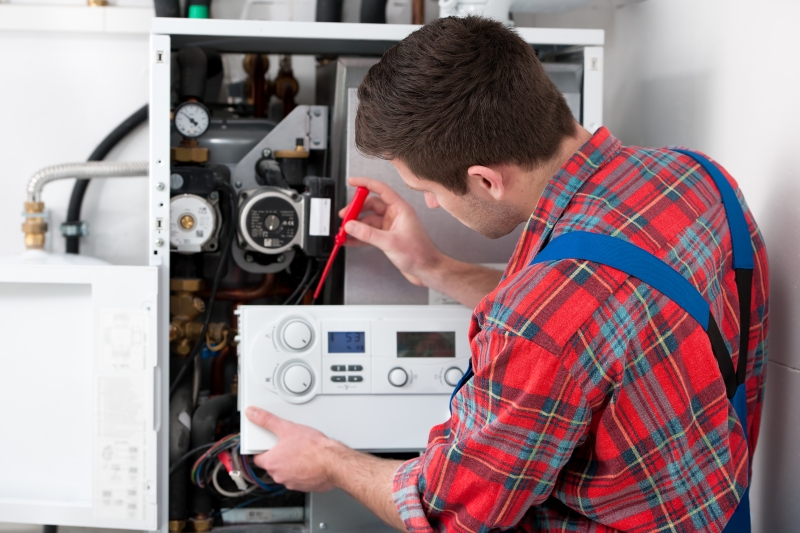 Gas Safe engineer working on a boiler in Tufnell Park